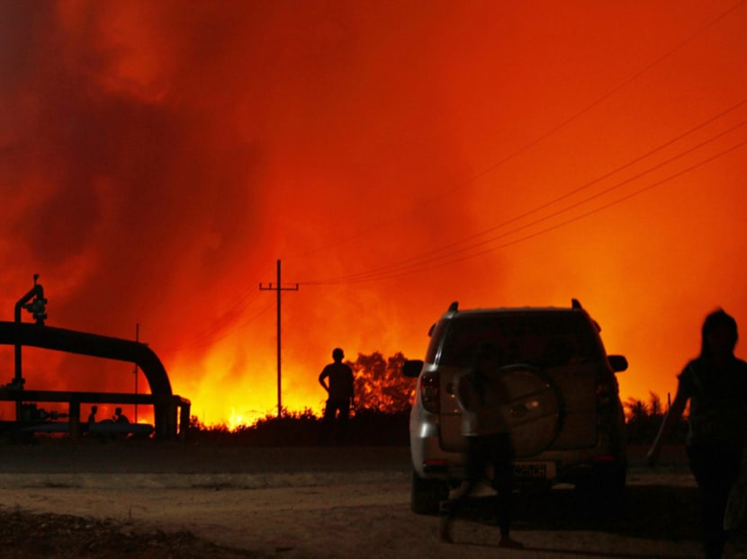 A palm oil plantation burning in haze-hit Bangko Pusako district in Rokan Hilir, Riau, last year. The number of fire incidents over the past few years has continued to increase in Indonesia’s 
Riau province. Photo: Reuters