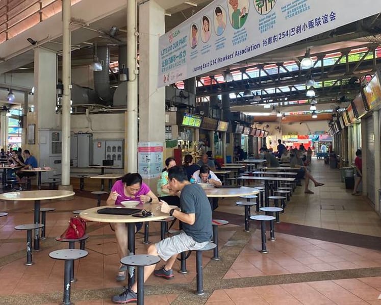 Hawker and son fined for cursing at safe-distancing ambassadors over mask, sitting on marked seat