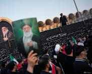 Three sons of Iran's slain leader appear at funeral, not his successor