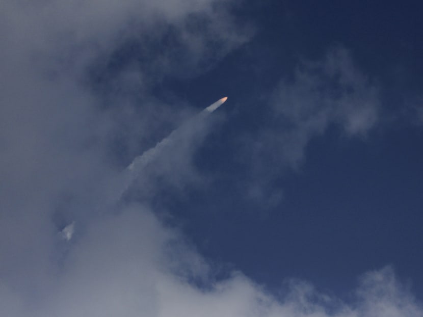 A rocket carrying the Mars orbiter streaks across the sky after taking off from the east-coast island of Sriharikota, India, Tuesday, Nov 5, 2013. Photo: AP