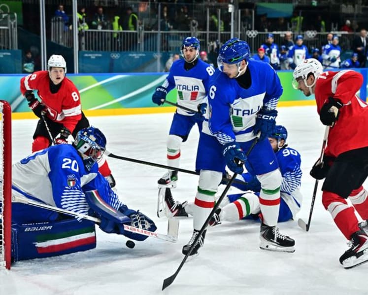 Ice hockey-Swiss ease past Italy to set up quarter-final with Finland