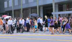 What does it mean for workplaces to treat COVID-19 like the common flu, even when cases spike?