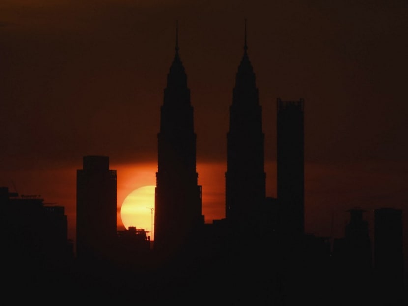 Malaysia's landmark Petronas Twin towers are silhouetted during sunset over the Kuala Lumpur skyline in Ampang, in the suburbs of Kuala Lumpur. Malaysia's landmark Petronas Twin towers are silhouetted during sunset over the Kuala Lumpur skyline in Ampang, in the suburbs of Kuala Lumpur.