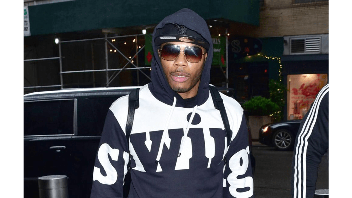 Nelly hits out at father in social media rant 8days