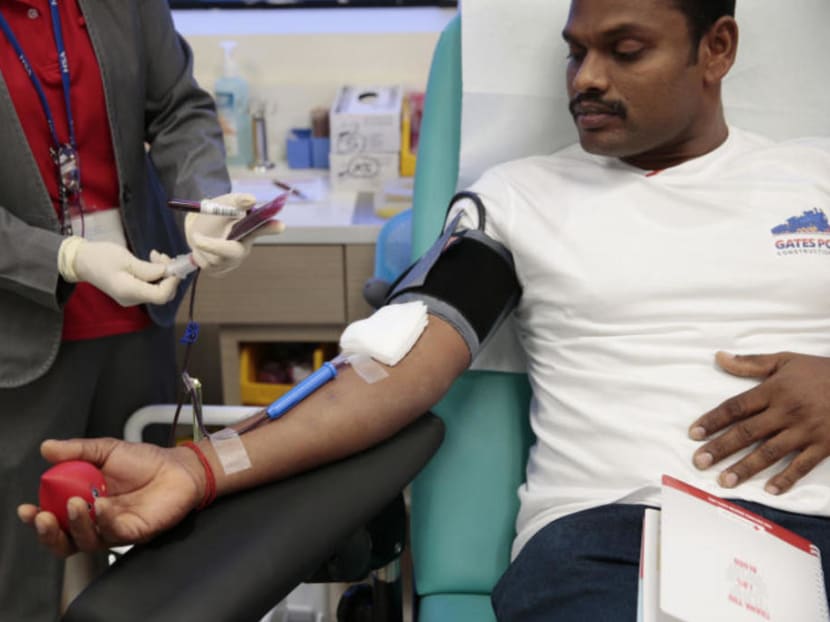 A blood donor giving blood at the Health Sciences Authority's blood bank.