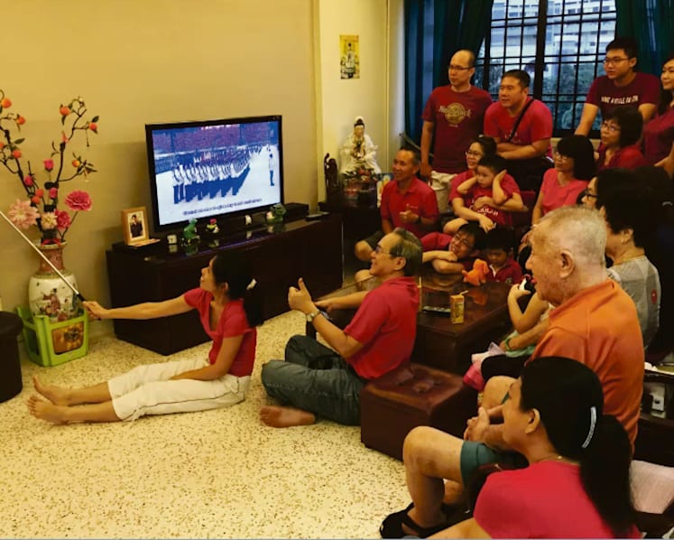 Singaporeans from all over gather to catch the action