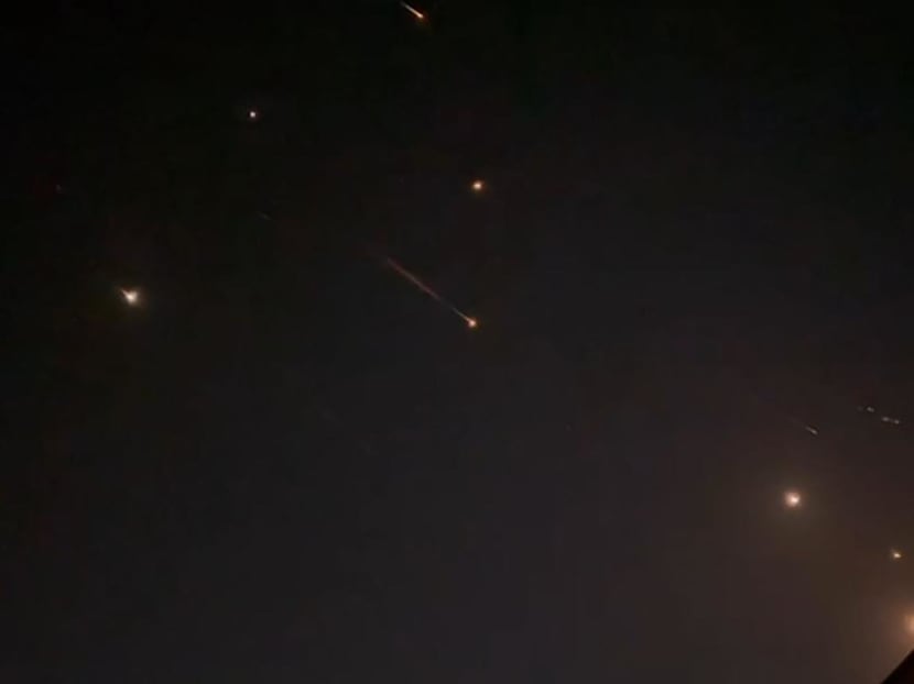 This video grab from AFPTV taken on April 14, 2024 shows explosions lighting up the sky in Hebron in the Israeli-occupied West Bank during an Iranian attack on Israel. This video grab from AFPTV taken on April 14, 2024 shows explosions lighting up the sky in Hebron in the Israeli-occupied West Bank during an Iranian attack on Israel.