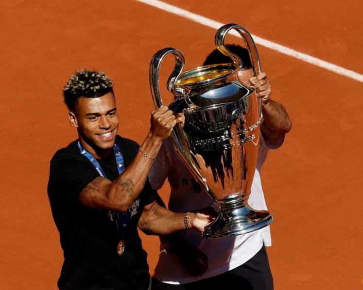 PSG players celebrate Champions League back-to-back titles with French Open crowd