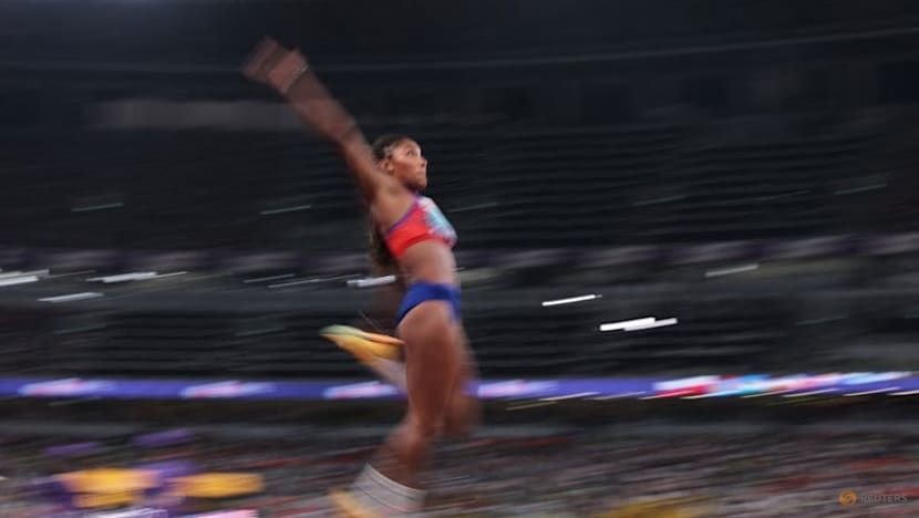 Davis-Woodhall adds world long jump title to Olympic crown