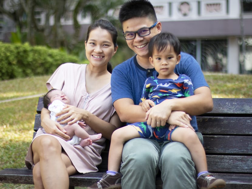 The author, seen here with his wife and two children, said that he previously struggled with the choice of whether to work at home and be around his son or to go to  school to be more effective.
