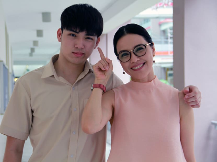 Calvert Tay, 17 (left), son of actor Zheng Geping and actress Hong Huifang, poses for a photo with his on-screen mother, actress Zoe Tay, 49. Both will be starring in Channel 8’s upcoming drama While We Are Young. Photo: Esther Leong/TODAY