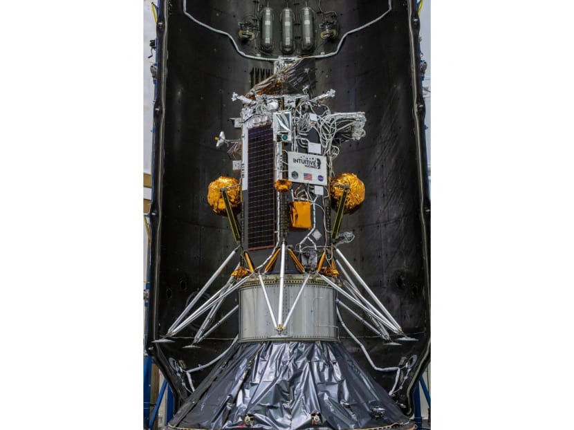 This handout picture obtained by Nasa on Feb 7, 2024 shows the Nova-C lunar lander encapsulated within the fairing of a SpaceX Falcon 9 rocket in preparation for launch.
