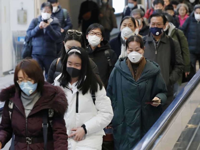 Passengers arriving from the Chinese city of Wuhan arrive at Narita Airport in Chiba, Japan in this photo taken by Kyodo January 23, 2020.