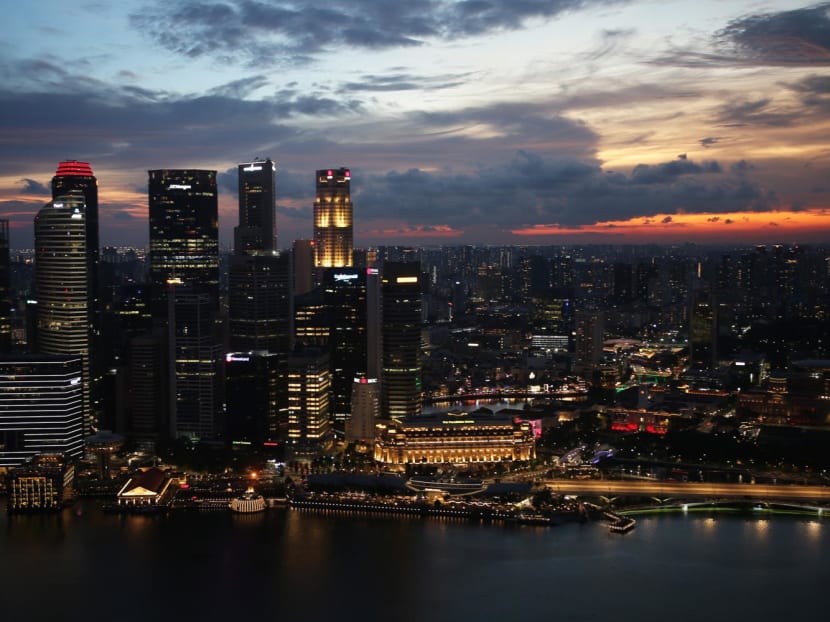 A view of Singapore's city skyline at dusk.