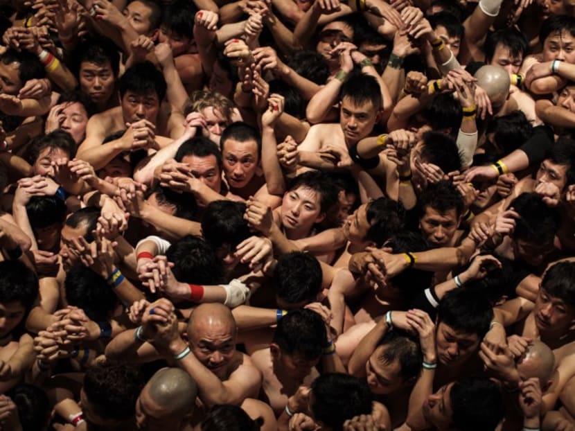 Worshippers wait for the priest to throw the sacred batons during the annual Naked Man Festival or 'Hadaka Matsuri' at Saidaiji Temple in Okayama, western Japan. Photo: AFP