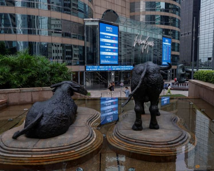 Asian stocks skid, Wall Street and bonds aided by oil slip 