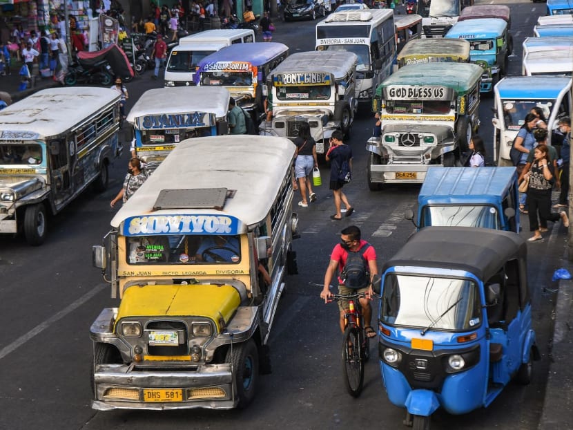 In this photo taken on April 5, 2024, jeepneys commute along a street in Manila. 