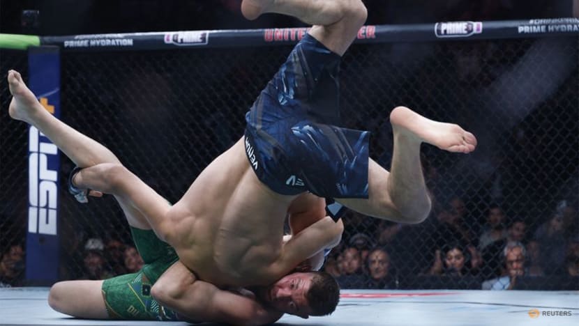 Relentless Chimaev beats du Plessis to win UFC middleweight title