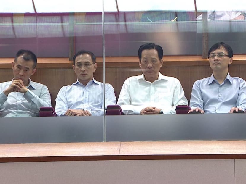 SMRT's Group Chief Executive Officer Desmond Kuek (2nd from left), and Chairman Seah Moon Ming (centre) attend Tuesday's Parliamentary session, where Transport Minister Khaw Boon Wan spoke about the tunnel flooding incident that shut down a segment of the North-South Line for about 20 hours last month.