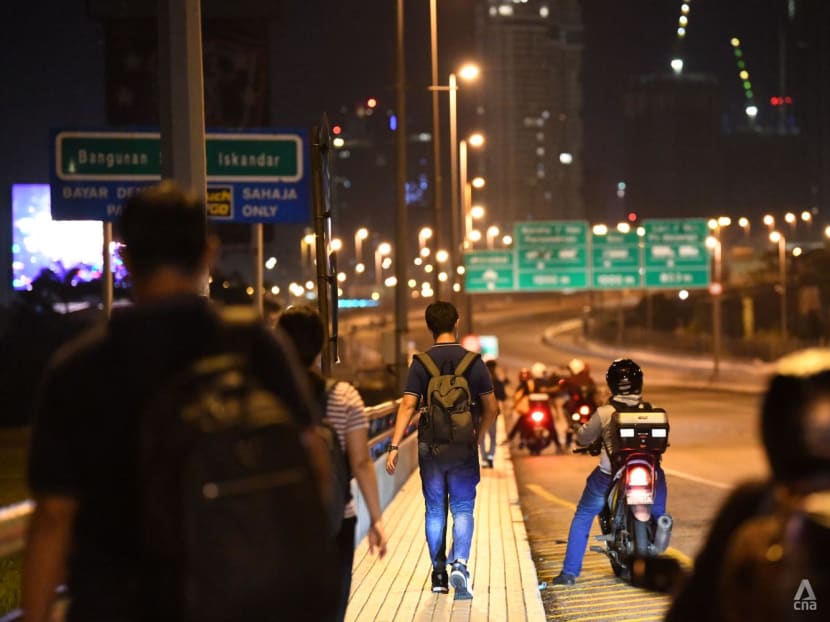 'I don't want to commute anymore': Some Malaysian workers settle in Singapore even as land border reopens