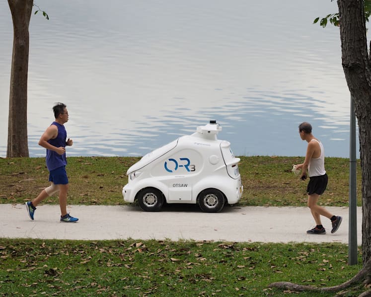 Miniature robot car goes on pedestrian paths to remind visitors to adhere to safe distancing rules