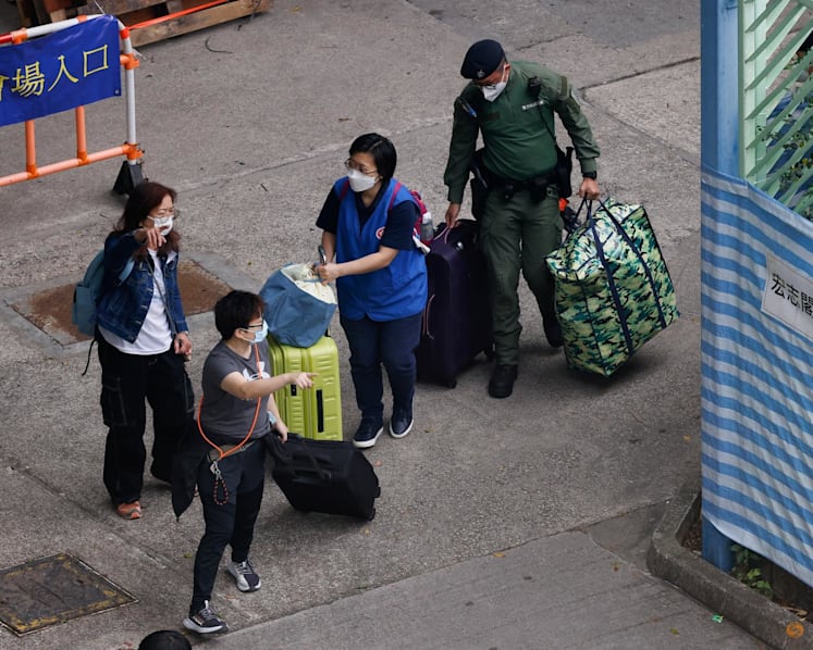 A week after Hong Kong's deadly fire, some residents return for belongings