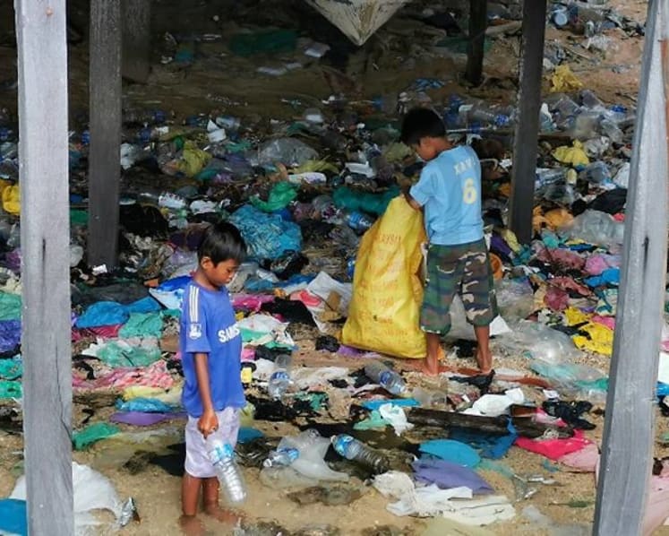 Living in a sea of trash: Sabah’s stateless children face bleak future 