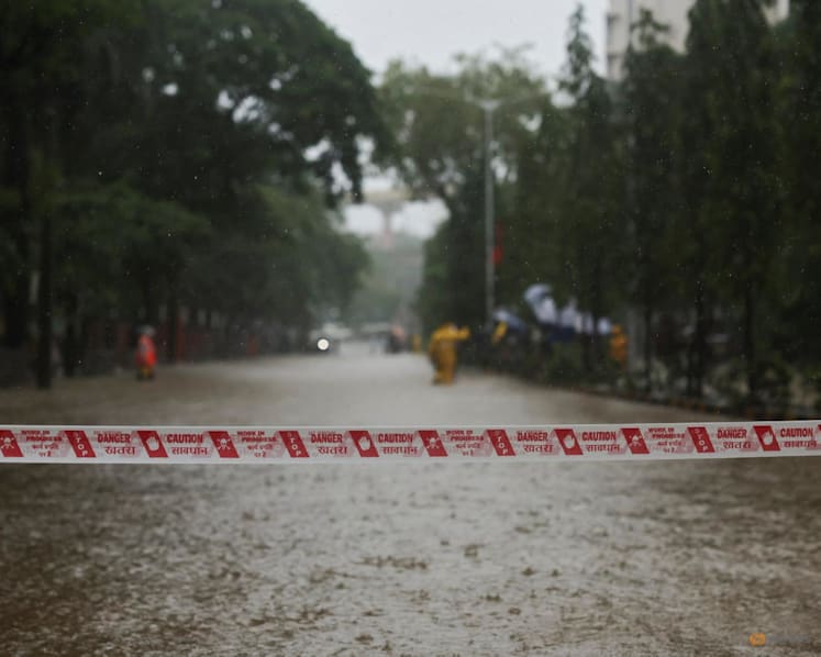 Building collapse kills six in Mumbai as torrential rain batters city