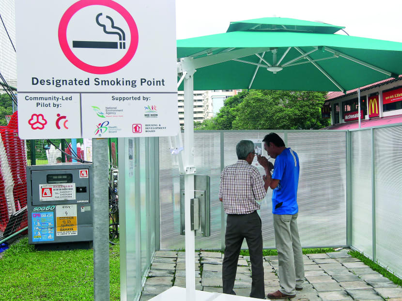 Smokers at one of the six designated smoking points installed at Nee Soon South. Smoke-free housing paves a way to harmonious living by minimising conflict between smoking and non-smoking neighbours. TODAY FILE PHOTO