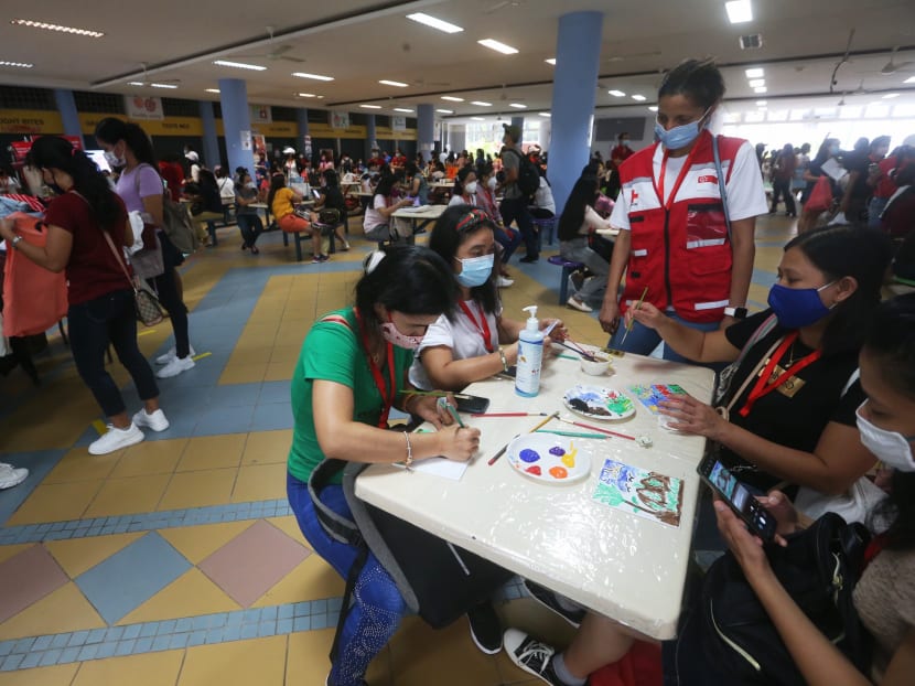 Foreign domestic workers gather at an alternative gathering site at the former Raffles Girl’ School (Secondary) at 20 Anderson Road on March 7, 2021. Foreign domestic workers gather at an alternative gathering site at the former Raffles Girl’ School (Secondary) at 20 Anderson Road on March 7, 2021.