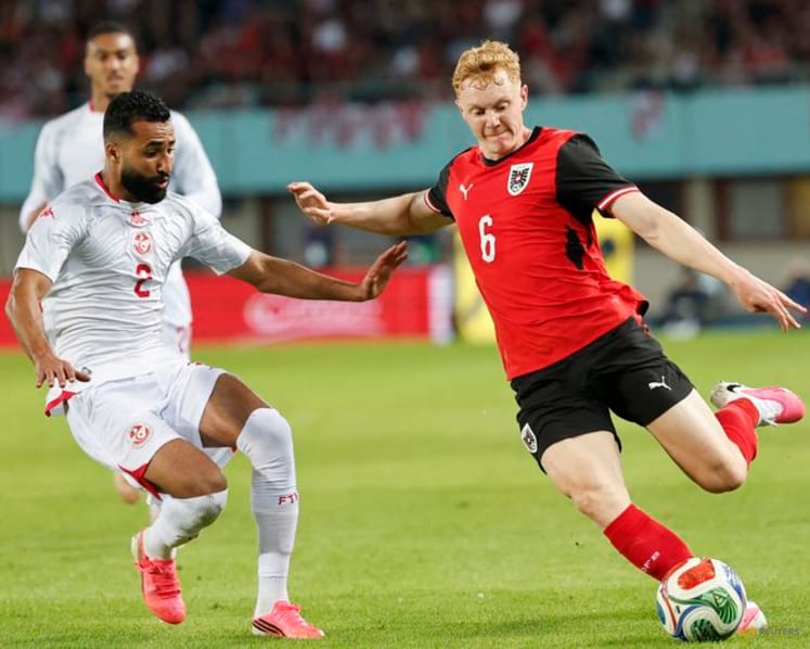 Austria fight back from early red card to beat Tunisia