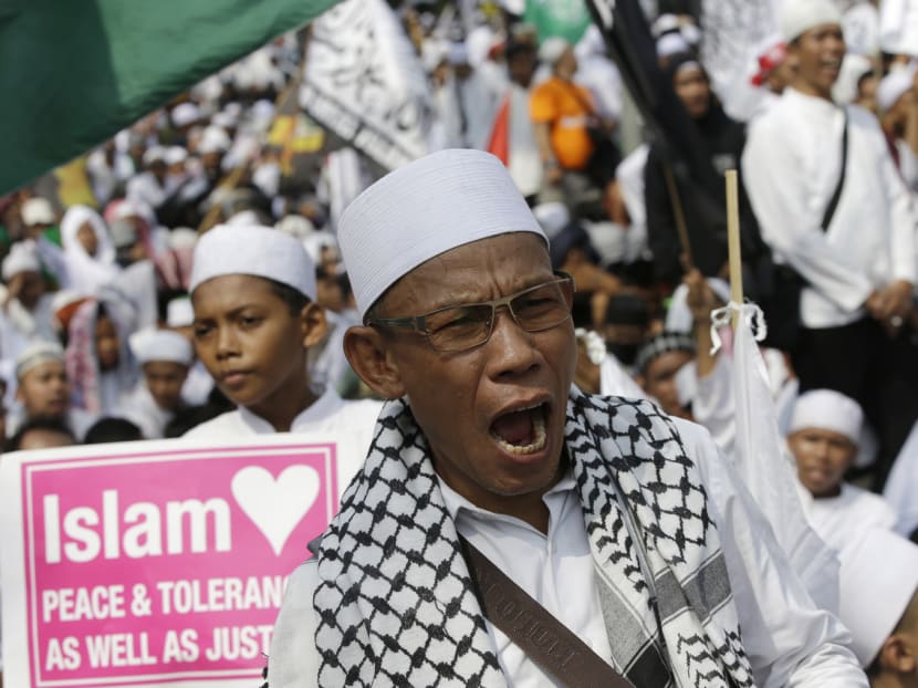 Protesters shouting slogans against Jakarta’s Christian Governor Basuki ‘Ahok’ Tjahaja Purnama in Jakarta on May 5. The two-year sentence handed down to Ahok for blasphemy against Islam has heightened concerns about the growing influence of hardline Islamist groups in Indonesia. Photo: AP