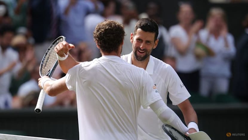 Djokovic moves past another Federer milestone to make Wimbledon quarter-finals