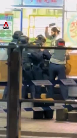 Woman attacks police with knife at Hong Kong eatery after payment fails