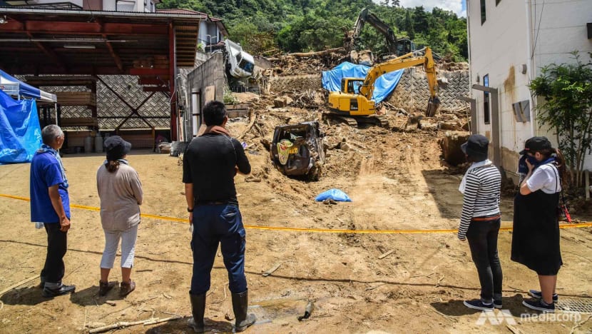 Japan flood: One week on, the wait for news no family wants to hear Japan flood: One week on, the wait for news no family wants to hear