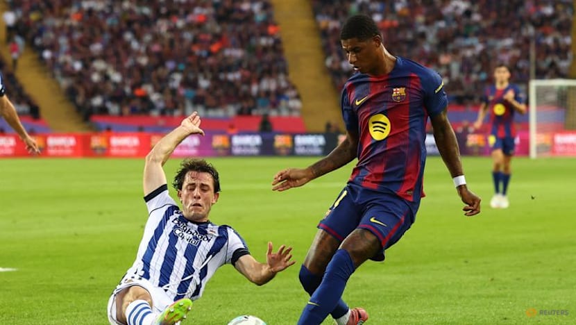 Barcelona go top with 2-1 win over Real Sociedad