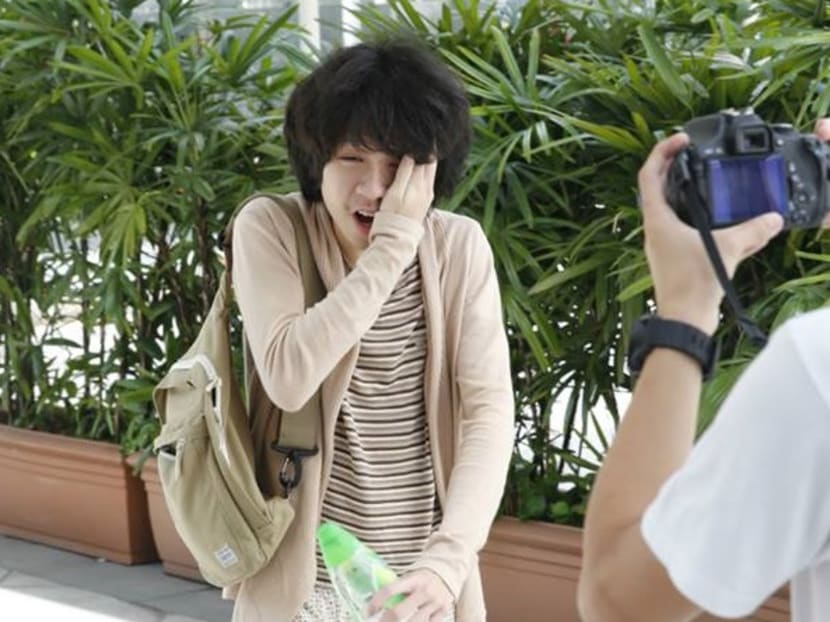 As Amos Yee was making his way into court today for his pre-trial conference, a stranger came up and slapped him in the face. Photo: Ernest Chua As Amos Yee was making his way into court today for his pre-trial conference, a stranger came up and slapped him in the face. Photo: Ernest Chua