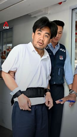 Government official impersonation scam suspect brought back to crime scene