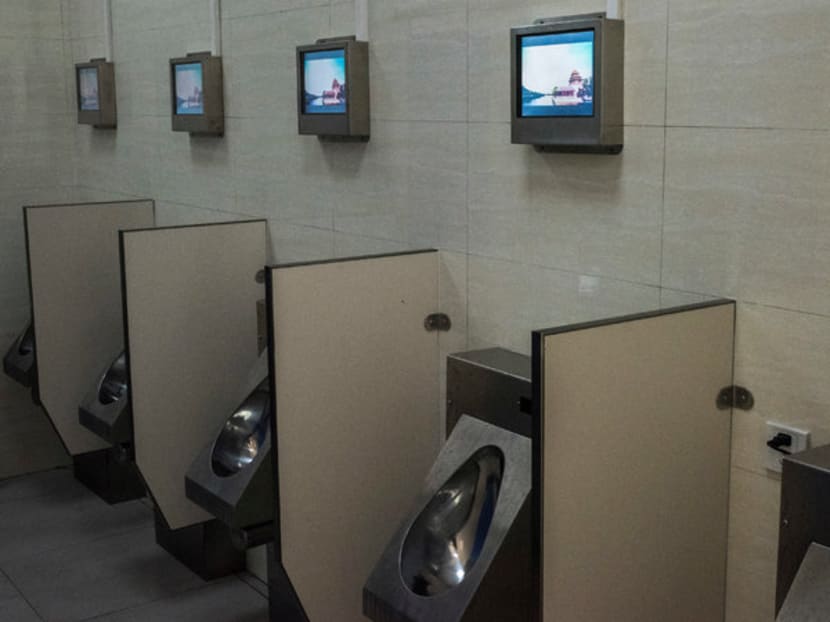 A state-of-the-art public toilet equipped with Wi-Fi, an ATM, chargers for mobile phones and electric vehicles, and personal television screens in China. A state-of-the-art public toilet equipped with Wi-Fi, an ATM, chargers for mobile phones and electric vehicles, and personal television screens in China.