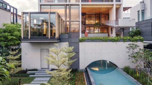 A Singapore home with zigzagging ramps and a cosy greenhouse