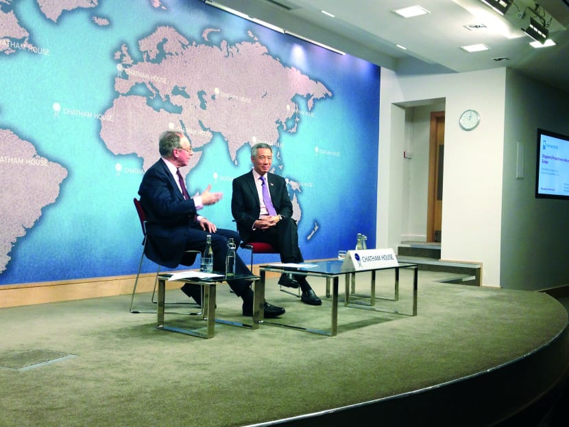 When answering Mr Malcolm Rifkind (left), Mr Lee said 
the Opposition made it clear during GE2011 that it was 
not seeking to take over the government. Photo: Lin Yanqin