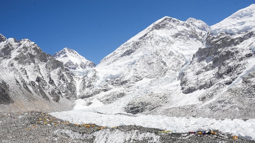 Record number of climbers scale Everest's Nepal side in single day