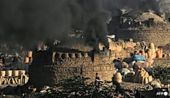 With monitors and lawsuits, Pakistanis fight for clean air