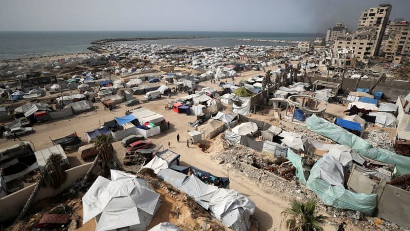 Palestinians flock to US-backed aid centres despite concern over checks