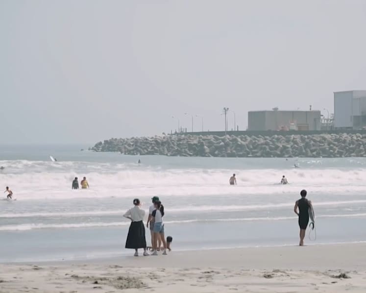 ‘We can’t continue to worry’: Japanese surfers ride waves near Fukushima nuclear plant