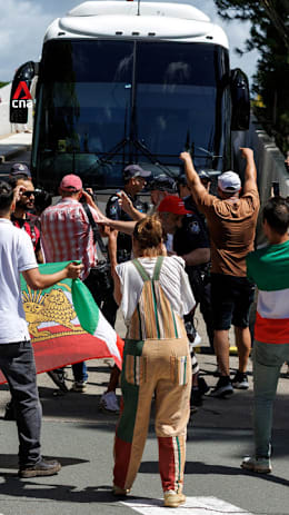 Protesters try to block Iranian women's football team bus leaving Australian hotel