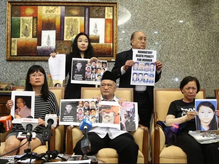 Representatives and family members of murder victims who refuse to accept the abolishment of the death penalty pose for a group photo in Putrajaya on Tuesday, Jan 14, 2020.
