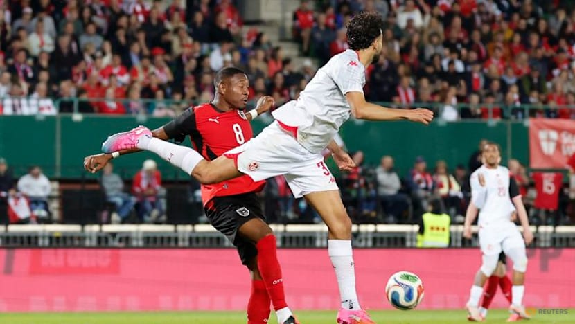 Austria fight back from early red card to beat Tunisia
