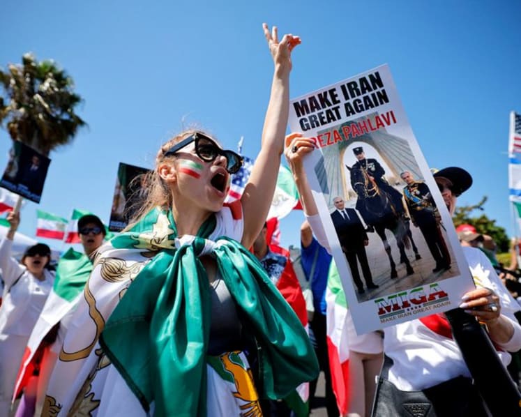 Iranian American protesters gather as soccer team prepare for World Cup opener