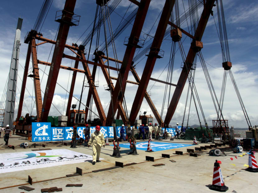 The construction of a 30km sea bridge and tunnel to connect Hong Kong with Macau and Zhuhai has been beset by cost overruns and delays. Photo: Reuters